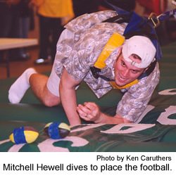 Mitchell Hewell dives to place the football