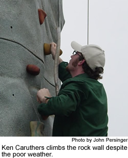 Ken Caruthers climbs the rock wall.