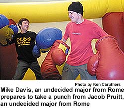 Mike Davis, an
undecided major from Rome,
prepares to take a punch from Jacob
Pruitt, an undecided major from
Rome