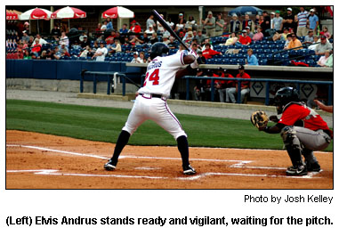 (Left) Elvis Andrus stands ready and vigilant, waiting for the pitch.