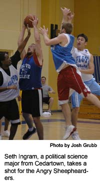 Tim Smith, an education major from Rome, (right), goes for the ball. 