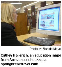 Cathey Hagerich, an education major from Armuchee, checks out springbreaktravel.com.