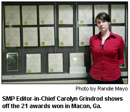 SMP Editor-in-Chief Carolyn Grindrod shows off the 21 awards won in Macon, Ga.