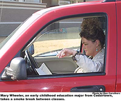 Mary Wheeler, an early childhood education major from Cedartown, takes a smoke break between classes.