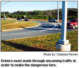 Drivers must wade through oncoming traffic in order to make the dangerous turn.