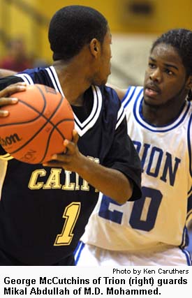 George McCutchins of Trion (right) guards Mikal Abdullah of M.D. Mohammed