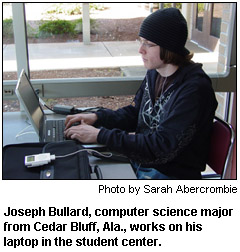 Joseph Bullard, computer science major from Cedar Bluff, Ala., works on his laptop in the student center.