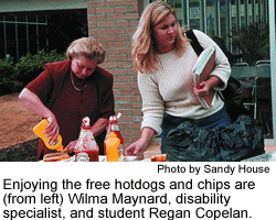 Wilma Maynard and Regan Copelan enjoying hotdogs