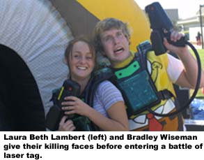 Laura Beth (left) and Bradley Wiseman give their killing faces before entering a battle of laser tag.