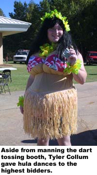 Aside from manning the dart tossing booth, Tyler Collum gave hula dances to the highest bidders.