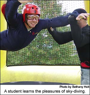 A student learns the pleasures of sky-diving.