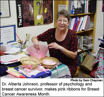 Dr. Alberta Johnson, professor of psychology and breast cancer survivor, makes pink ribbons for Breast Cancer Awareness Month.