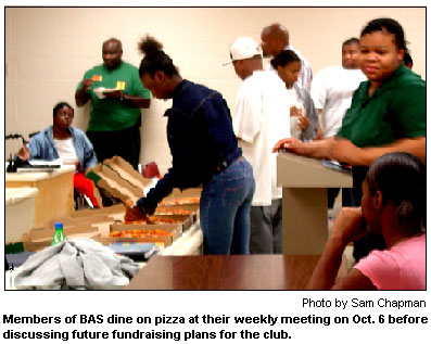 Members of BAS dine on pizza at their weekly meeting on Oct. 6 before discussing future fundraising plans for the club.