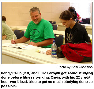 Bobby Cavin and Lillie Forsyth get some studying done before fitness walking.