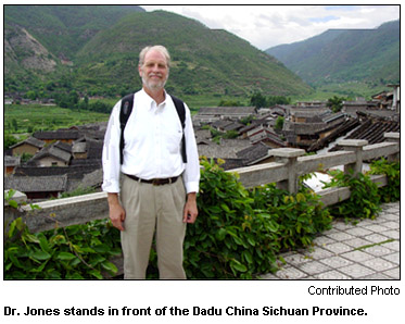 Dr. Jones stands in front of the Dadu China Sichuan Province.