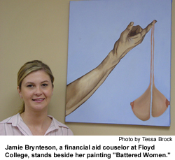 Jamie Brynteson, a financial aid couselor at Georgia Highlands College,
stands beside her painting Battered Woman.