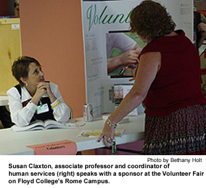 Susan Claxton, associate professor and coordinator of human
services (right), speaks with a sponsor at the Volunteer Fair
on Georgia Highlands College's Rome Campus
