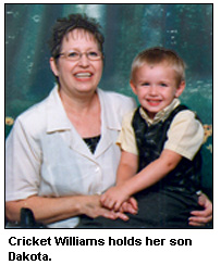 Cricket Williams holds her son Dakota