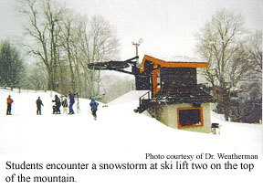 Students encounter a snowstorm at ski lift two on the top of the mountain. 