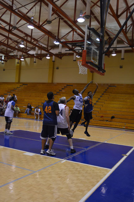 Chris Hill (32) of True Grit and Rashaun Dean of GHC Hoopers fight for a rebound in the Intramural Basketball championship game. Photo by Catlyn Mullinax.