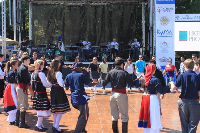 Atlanta Greek Festival attendees dance together. Photo by Jessie Summers.