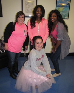 Students participating in Woman 2 Woman breast cancer awareness event on the Douglasville campus. In back, from left are Chelsea Hadaway, Ednard Salvant and Edlinard Salvant. Kneeling is Brooke Smith. Photo by Holly Chaney.
