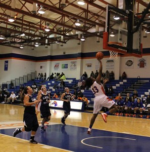 Michaela Suttles, 33, goes to score while the Lady Bobcats watch