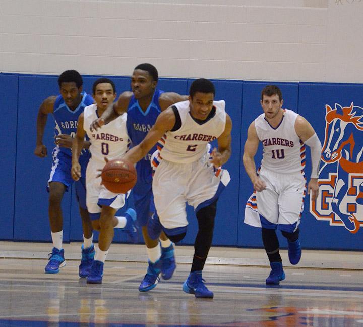 Montrel Goldston rushes past Gordons defense during the first home game of the 2013-2014 season. Goldston was a top scorer with 14 points. Photo by Pedro Zavala