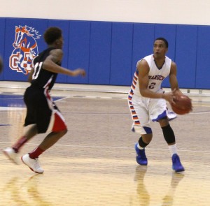 An Albany Tech player tries to block Montrel Goldston II during the game on Jan. 8. Photo by Ryan Jones