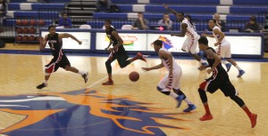 Montrel Goldston II charges past the defense during the game against Albany Tech. Chargers win with a final score of 68-60. Photo by Ryan Jones