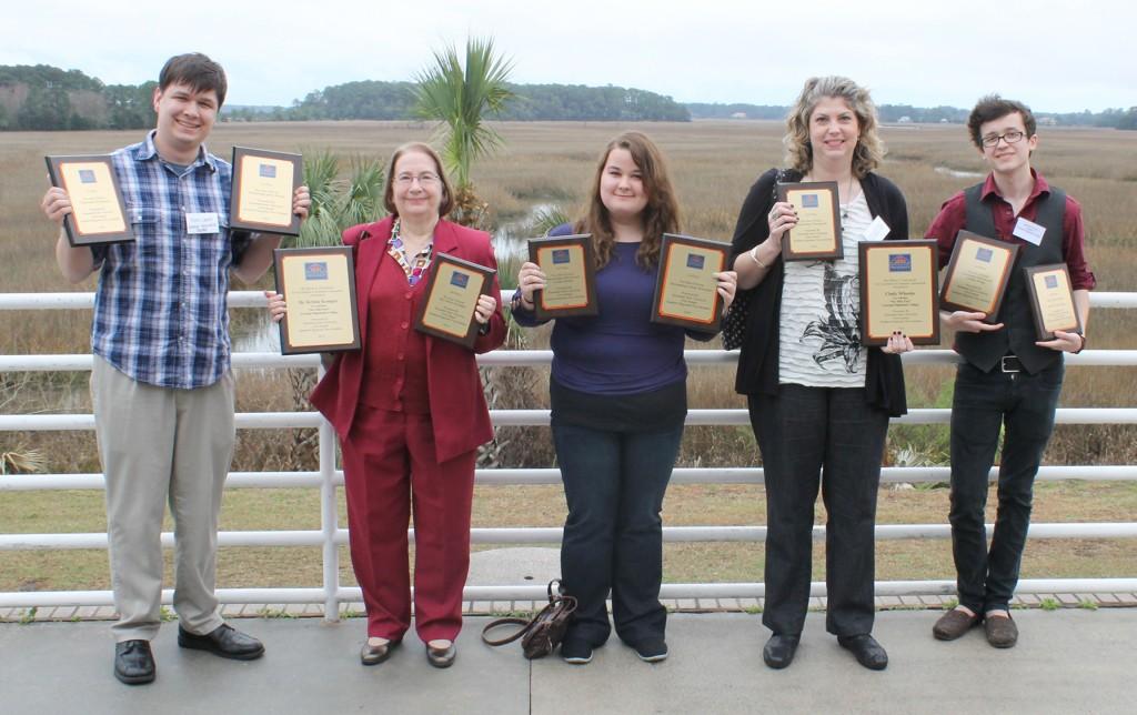 Six Mile Post staff members and advisers hold some of the awards received for journalism excellence during the Southern Regional Press Institute hosted by Savannah State University. From left to right, Ryan Jones, chief photographer; Kristie Kemper, adviser; Ashlee Gilley, staff writer; Cindy Wheeler, assistant adviser; and Antonio Garcia, managing editor of online. Photo contributed.