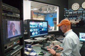 Jeff Brown, director of digital media services, edits footage in the control room at GHTV during the taping of “Community Watch.” Photo by Derweatra Hammock.