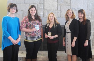 Amelia Bagwell (center) is the winner of the first Women's History Month Essay Contest at Georgia Highlands and runner-up Samantha Crider (inner-left) stand with Leslie Johnston, instructor of English (outer-left), Leslie Johnson, assistant professor of communication (inner-right) and Stacy Brown, assistant librarian (outer-right).