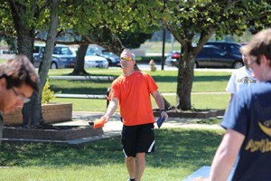 Brandan Harrell participates in the cornhole promotion. Photo by Adam Hatcher.