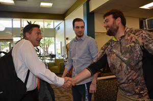 From left: New Georgia Highlands President, Donald J. Green, greets students Hunter Walden and Adam Hatcher in the Floyd campus library. Photo by Jeremy Huskins.