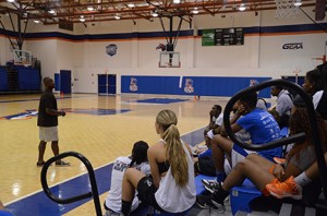 Ken Irvin talks to the basketball teams about the importance of education. Photo by Karlee Helms.