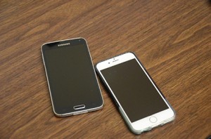 The Galaxy S5 (left) and the iPhone 6 are shown side-by-side. Photo by Anna Douglass.