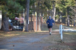 Bill Cox, male winner of the 2014 Floyd campus Turkey Walk-Run, approaching the finish line.