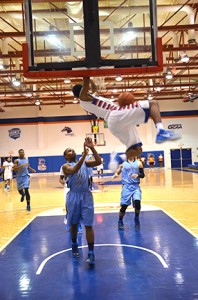 Denzel Council slam dunks on the Cleveland State Cougars. Photo by Karlee Helms