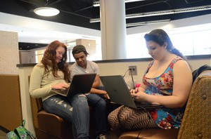 (From left) Student Lauren Glass, friend Zach Daum, and student Jennifer Burks study in the Student Center. Photo by Anna Douglass.