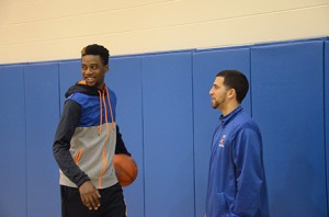 Lucien (left) and Williams talk in the gym before the Lady Chargers’ win over Andrew College. Photo by Adam Hatcher.