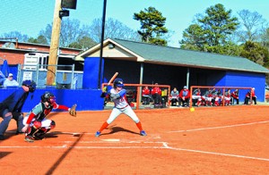 Kristen Mullis hits  a ball during the first softball game of the season against Gadsden State Community College. Photo by Shelby Hogland