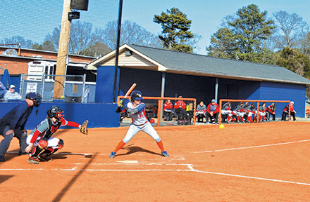 Kristen Mullis hits  a ball during the first softball game of the season against Gadsden State Community College. Photo by Shelby Hogland