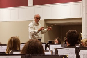 Samuel Baltzer conducts the NW GA Winds during one of their recent concert rehearsals. Jeremy Huskins.