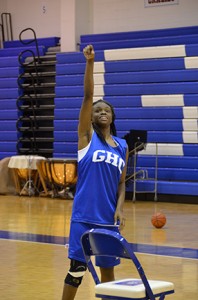 Alesheia Johnson practices her shooting during basketball workouts. 