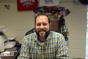 Spranza smiles as he's surrounded by his work, planning the next student activity for GHC. Photo by Lydia Chandler