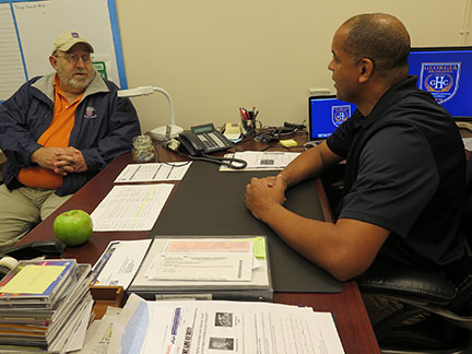 GHC Chief of Police David Horace confers with college Security Officer Ralph Mallad. Photo by Holly Chaney