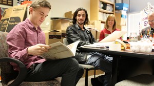 ORK staff and advisers read submissions in their office. They are (from left) Caleb Howard, literary editor; Wesley Sanders, art editor; and faculty advisers Nancy Applegate and John Kwist.