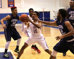 Will Gibbons fights off the Gordon State College defense to get to the basket and score a point. Photo by Daniel Smith