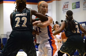 Deana Blankinship battles her opponent right before she gets a free throw shot. 